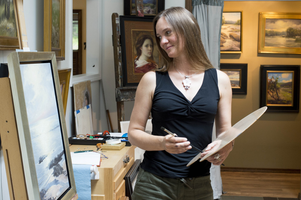 Olena Babak, a native of Ukraine and a Hartland artist, stands in her studio Saturday as she takes part in the Wesserunsett Arts Council's Open Studio Tour.