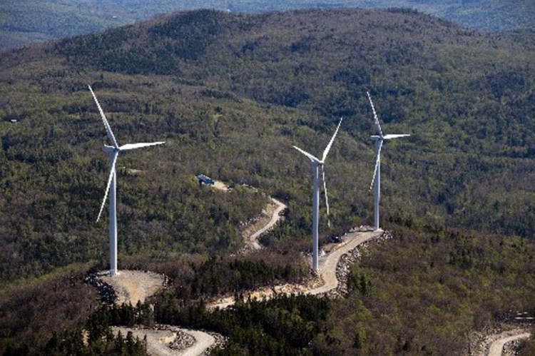 Three wind turbines are seen atop a ridge just south of Webb Lake in this aerial photograph taken May 14, 2015. Plans for new wind turbines in Somerset County may involve ridges in the remote townships of Johnson Mountain, Chase Stream and Misery, just east of Moosehead Lake, as well as Big Moose Mountain ridge line near Big Indian Pond.
