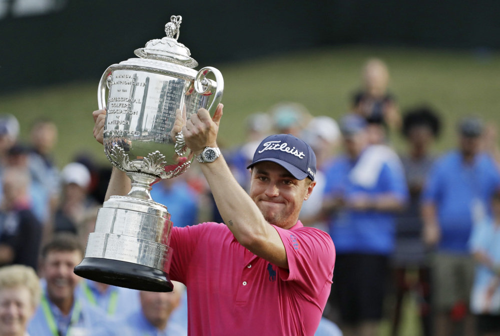 Justin Thomas poses with the Wanamaker Trophy after winning the PGA Championship on Sunday at the Quail Hollow Club.
