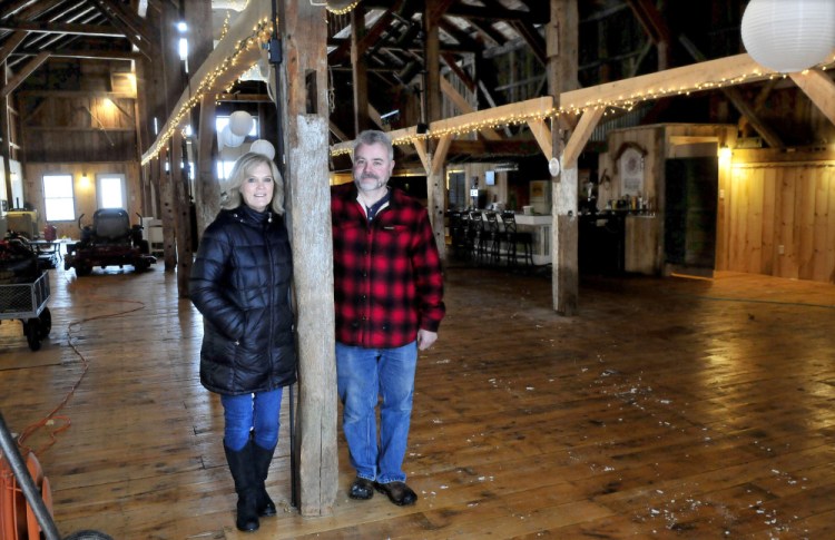 Cathy and Parris Varney stand inside their renovated barn in China on Feb. 9, 2017. A neighborhood association is insisting that the town code enforcement officer should take action against the Varneys over reports of them hosting events inside the barn without a town permit.