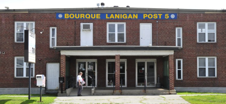 A woman enters the American Legion hall, Bourque-Lanigan Post 5 in Waterville on Monday. The Post says it is selling the building to the Augusta-based Children's Discovery Museum.