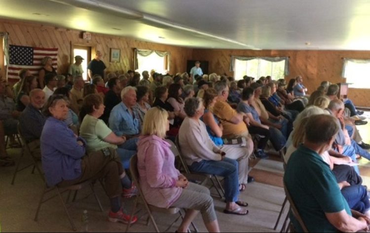 People listen to concerns over plans for more wind turbines before a meeting of Somerset County commissioners Wednesday at the Rockwood Community Center.