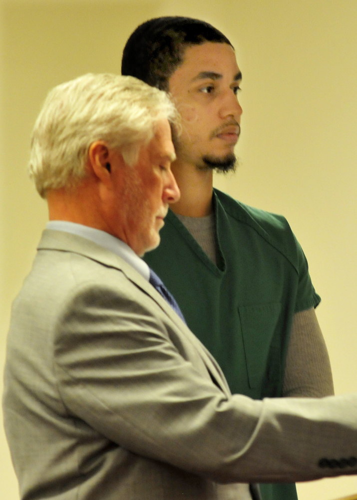 Defendant Dreaquan Foster, right, attends an arraignment hearing on charges related to a Sidney home invasion last spring at the Capital Judicial Center in Augusta on Thursday. At left is his attorney, Thomas Tilton.