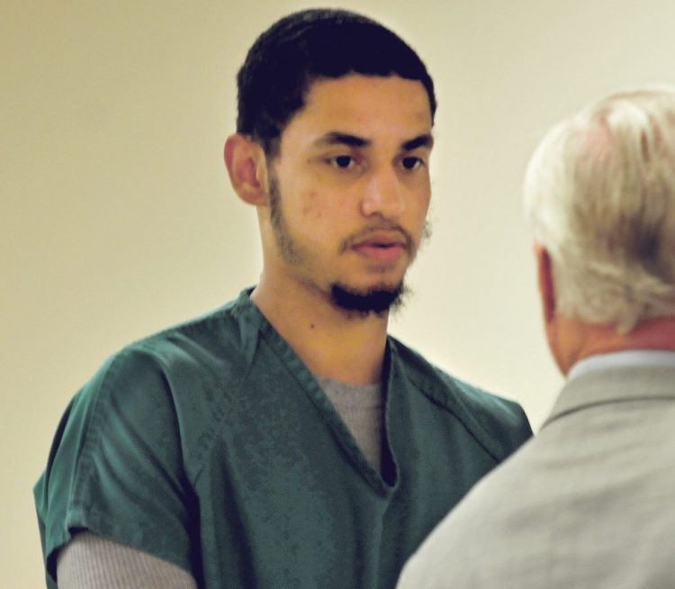 Defendant Dreaquan Foster on Thursday consults with his attorney, Thomas Tilton, during his arraignment at the Capital Judicial Center in Augusta on charges related to a Sidney home invasion last spring.