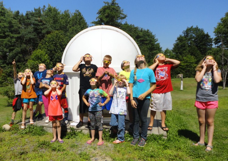 L.C. Bates Museum astronomy campers test their solar-viewing glasses in preparation for the partial eclipse on Monday.