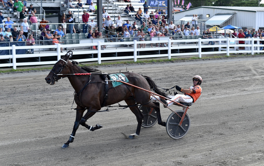 Drew Campbell crosses the finish line driving JJs Jet to win the Hight Invitational at the Skowhegan Fair on Saturday.