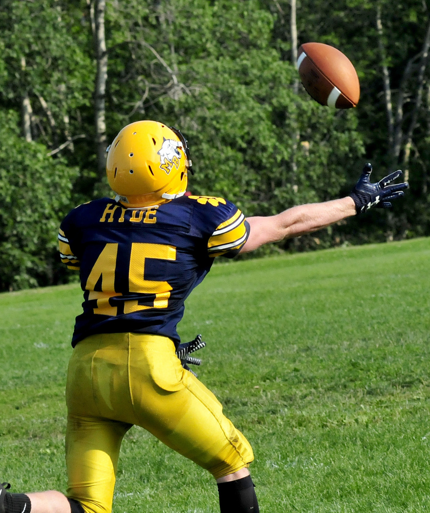 Mt. Blue's Matt Hyde reaches for ball during a scrimmage against Messalonskee on Monday in Oakland.