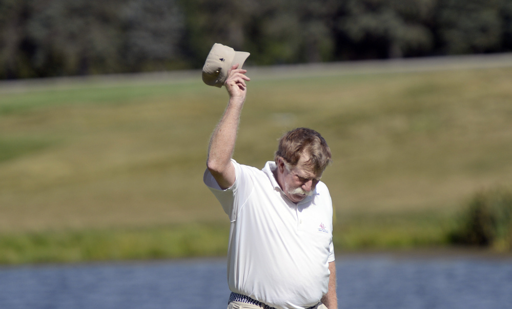 Manchester native Mark Plummer tips his hat after winning the Maine Senior Amateur on Wednesday at the Falmouth Country Club.