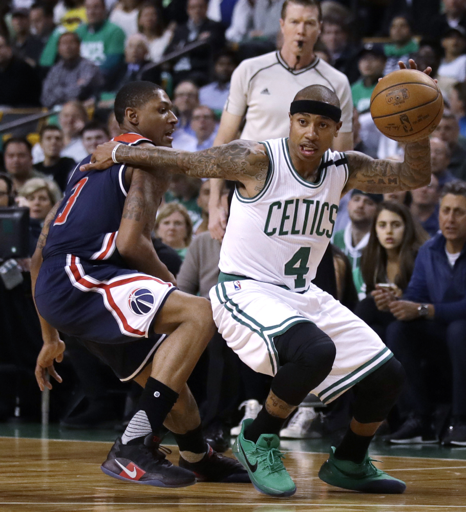 Boston Celtics guard Isaiah Thomas drives to the basket during the first quarter of a second-round playoff series game in Boston.