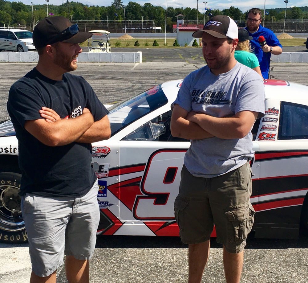 Derek Kneeland, left, and D.J. Shaw discuss the upcoming Oxford 250 during media day Wednesday at Oxford Plains Speedway. The race is Sunday.