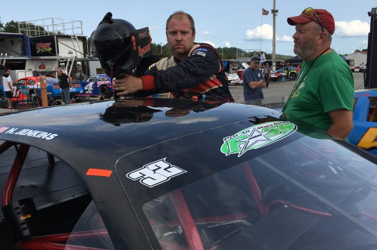 Nick Jenkins of Brownville climbs out of his car following an Oxford 250 practice session on Friday at Oxford Plains Speedway in Oxford.