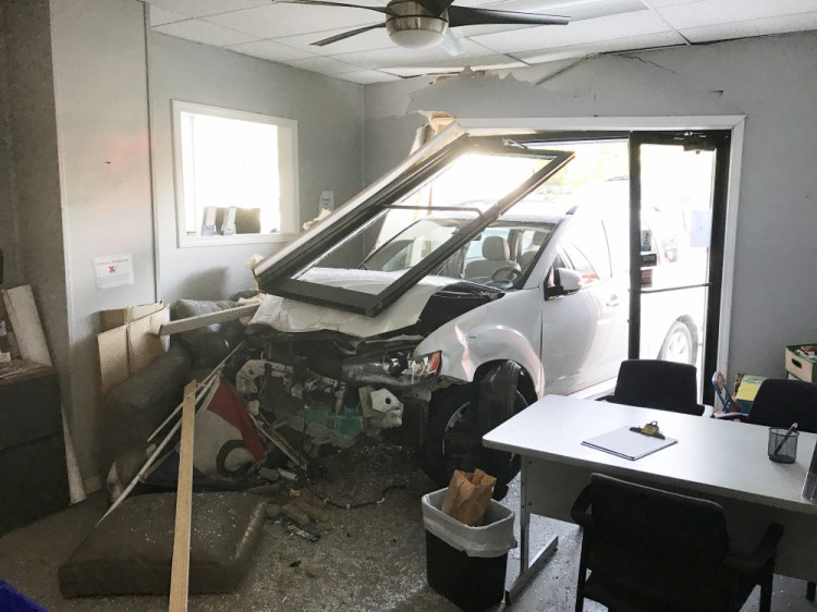 A vehicle crashed into Lady's Auto Sales just before 8 a.m. Tuesday after a driver suffered a medical problem.