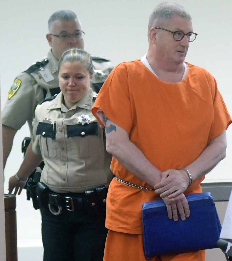 Thomas Mitchell enters a courtroom Wednesday at the Capital Judicial Center in Augusta to ask for a new trial of his murder conviction for the 1983 stabbing death of Judith Flagg in Fayette.