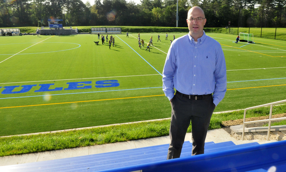 Colby College athletic director Jake Olkkola talks about the new school athletic fields, including the field hockey field, Thursday morning.