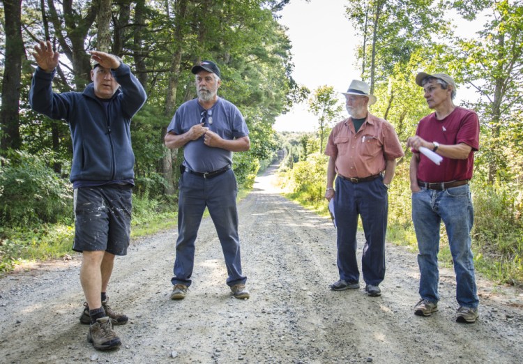 Whitefield town officials and residents gathered Monday on Hollywood Boulevard to discuss the removal of trees to enhance road safety and improve drainage. From left are Chris Hamilton, who lives on the road; Road Commissioner David Boynton; and Selectmen Frank Ober and Tony Marple.