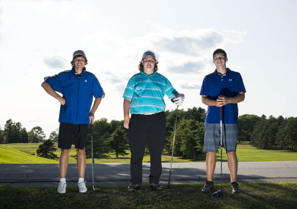 Erskine golfers, from left, Connor Paine, Aaron Pion and Justin Browne pose at Natanis Golf Course in Vassalboro on Thursday.
