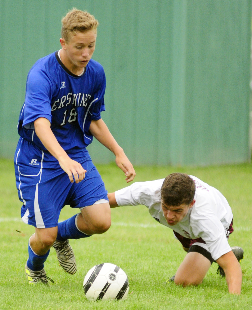 Erskine's Sam York, left, keeps the ball away from Monmouth defender Thomas Neal during an Aug. 19 play day in Augusta.