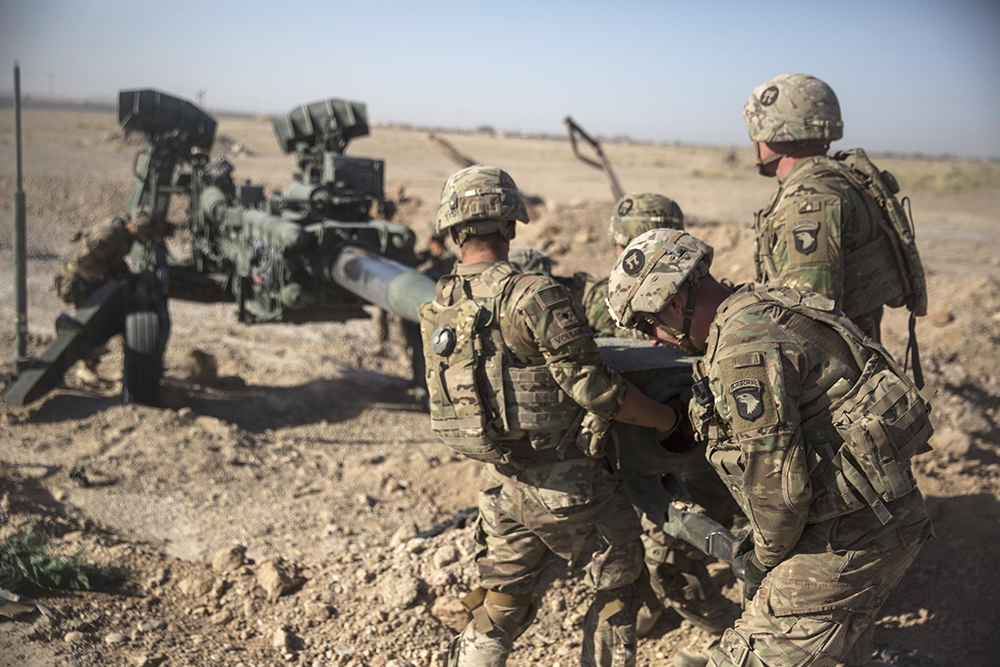 U.S. soldiers with Task Force Iron maneuver an M-777 howitzer into position at Bost Airfield, Afghanistan, on June 10, 2017.