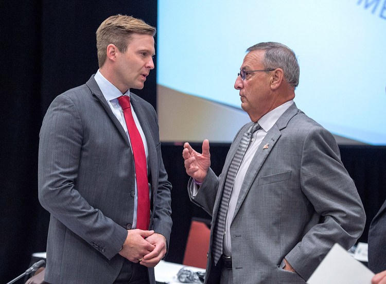 New Brunswick Premier Brian Gallant and Maine Gov. Paul LePage talk at the start of a meeting of New England governors and Eastern Canadian premiers in Charlottetown, Prince Edward Island, on Monday.
