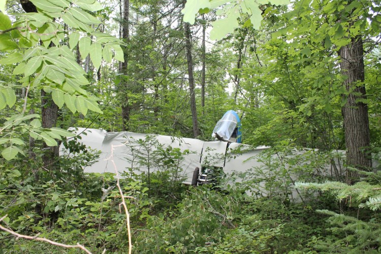 Bill Fuller, 75, of Clinton walked away from the wreckage of an ultralight plane that crashed Tuesday morning in the woods off Neck Road in Benton Tuesday morning.  Fuller suffered minor injuries from the crash.