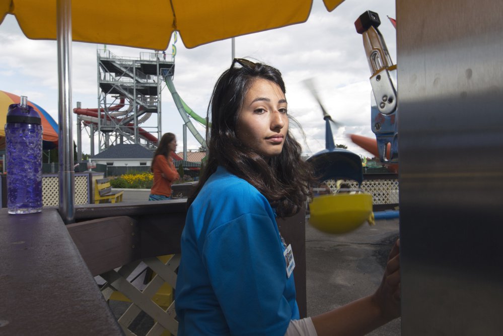 Ceren Han, 20, of Turkey operates a ride Thursday at Funtown Splashtown USA in Saco. Han holds a J-1 visa,which allows foreign college students to work in the U.S. as part of a cultural exchange program.