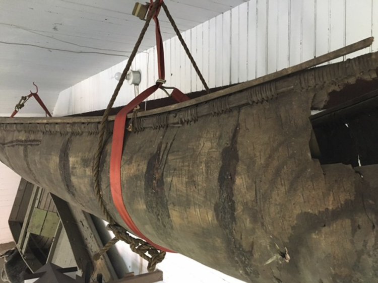 A Wabanaki-made birch-bark canoe that was carbon-dated to the 1700s hangs in a barn behind the Pejepscot Historical Society museum in Brunswick.
