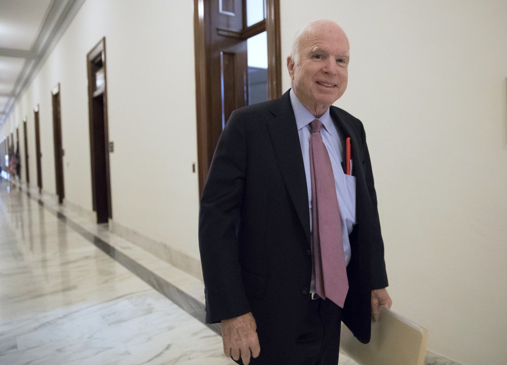 Sen. John McCain, R-Ariz., walks from his Senate office Tuesday as Congress returns from the August recess to face work on immigration, the debt limit, funding the government, and help for victims of Hurricane Harvey.