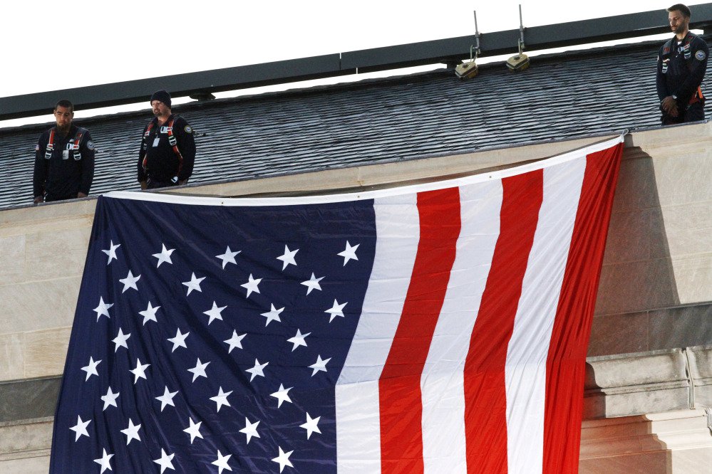A U.S. flag is unfurled at the Pentagon on the 16th anniversary of the Sept. 11 terrorist attacks Monday.