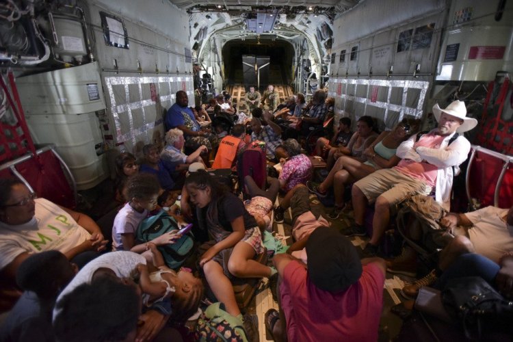 U.S. Air force personnel evacuate U.S. citizens from St. Martin aboard an aircraft after the passage of Hurricane Irma on Tuesday.