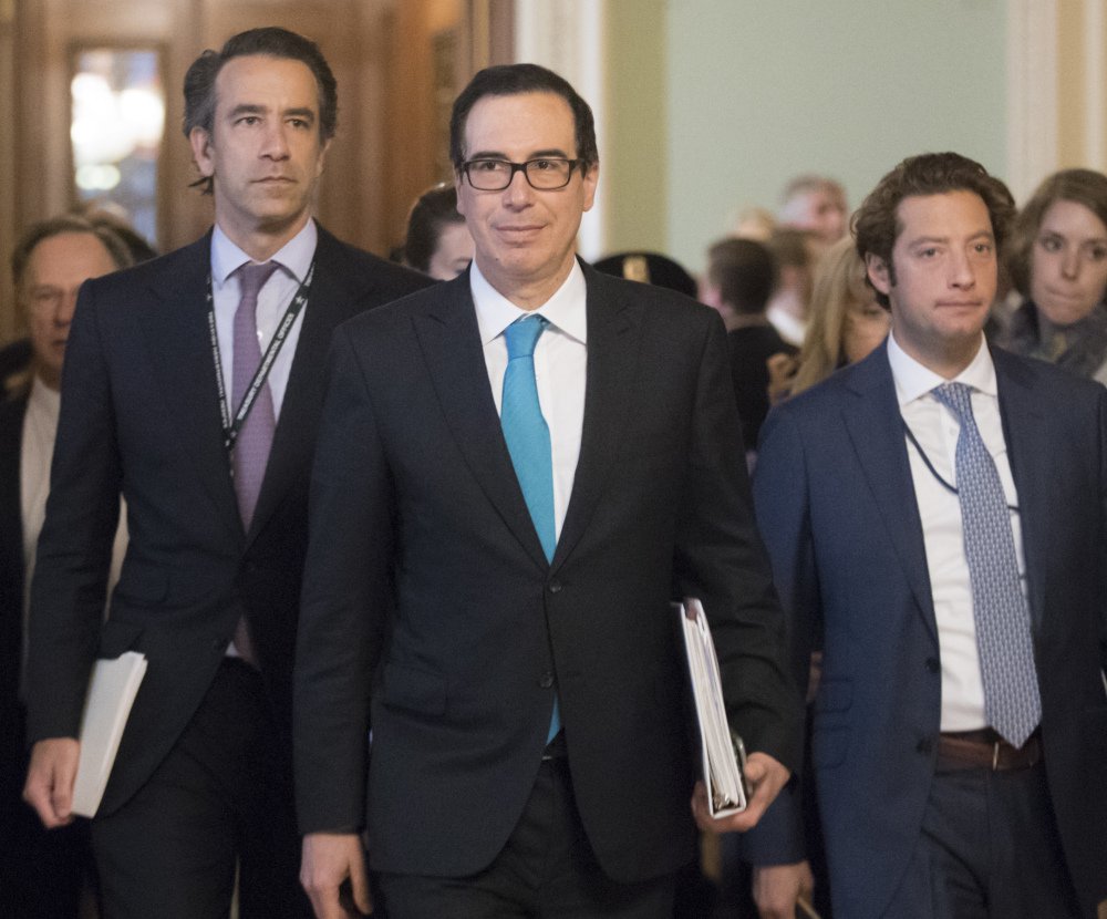 Treasury Secretary Steven Mnuchin arrives at the Capitol on Tuesday for a closed-door meeting with Senate Majority Leader Mitch McConnell, R-Ky., on the tax code overhaul.