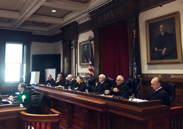 The Maine Supreme Judicial Court hears arguments Wednesday on whether an employer in Maine, where medical marijuana is legal, must reimburse an injured worker for a drug that is illegal under U.S. law.
