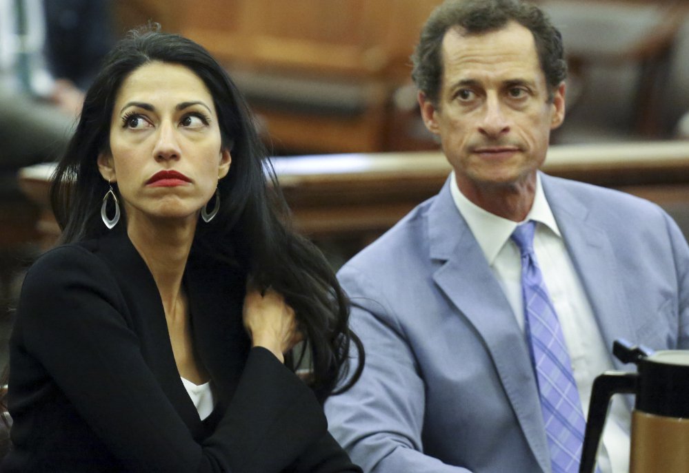 Huma Abedin and Anthony Weiner are seen in court Wednesday in New York.