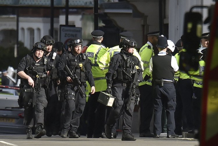 Armed police respond at Parsons Green station in west London after an explosion on a packed London Underground train on Friday.