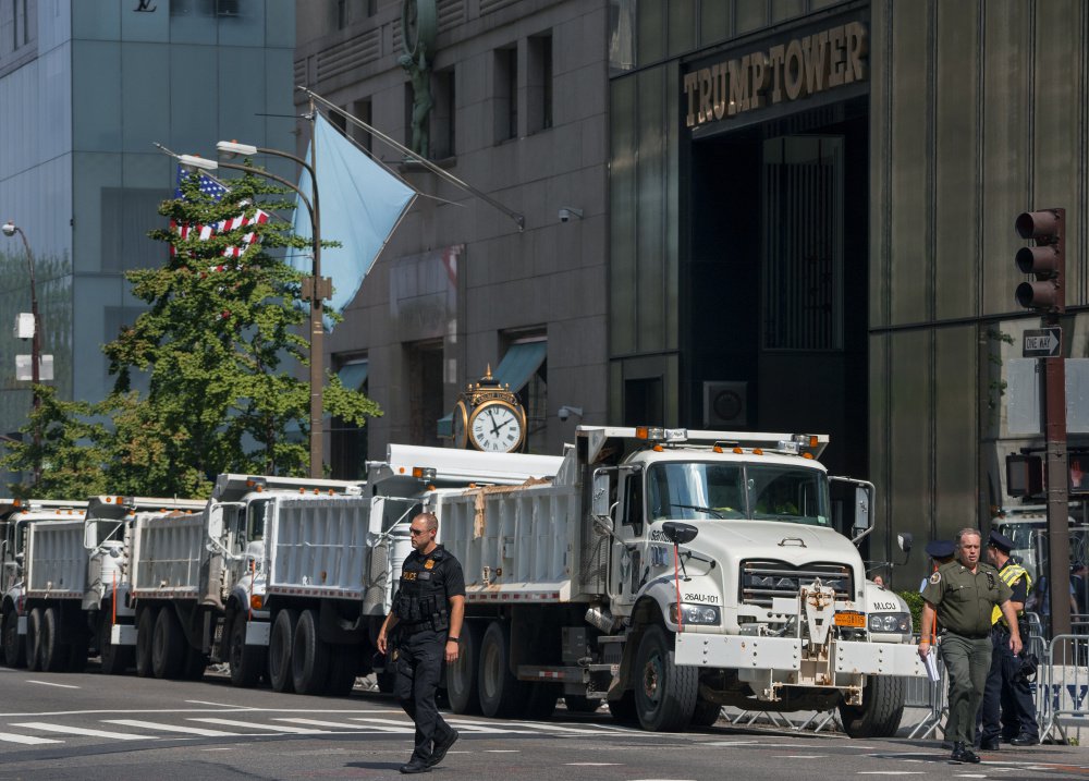 Dump trucks full of sand are lined up along Fifth Avenue in front of Trump Tower in New York on Sunday. World leaders gather at the United Nations starting Monday. President Trump and France's new leader, Emmanuel Macron, will both be making their first appearance at the General Assembly.