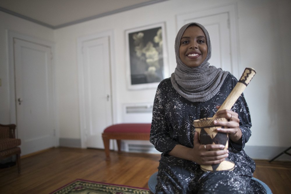 Eiman Ali, of Somalia and born in Yemen, poses for a portrait during an interview in one of the bedrooms of President Trump's boyhood home. The international anti-poverty organization Oxfam rented it Saturday and invited refugees to share their stories with journalists.