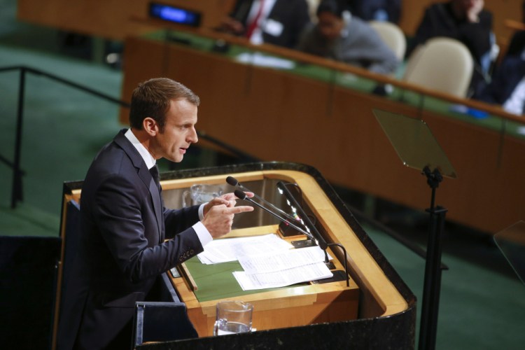 French President Emmanuel Macron addresses members of the U.N. Tuesday. How vowed to push on with the Paris accord, from which the U.S. has said it is withdrawing.