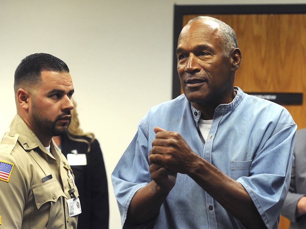 Former pro football star O.J. Simpson reacts after learning he was granted parole this July at Lovelock Correctional Center in Lovelock, Nev.