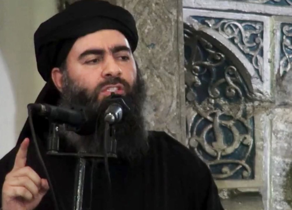 This file image made from video posted on a militant website in 2014 purports to show the leader of the Islamic State group, Abu Bakr al-Baghdadi, delivering a sermon in Iraq.