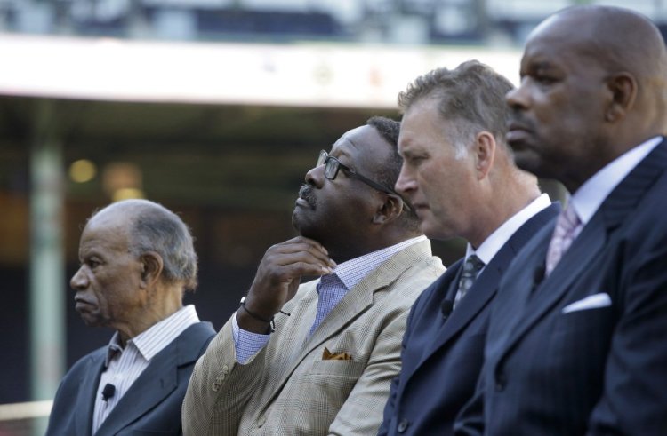 Boston Red Sox Hall of Famer Tommy Harper, left, NFL Hall of Fame linebacker Andre Tippett, center left, Bob Sweeney, executive director of the Boston Bruins Foundation, center right, and Cedric Maxwell, former Boston Celtics player, help introduce an initiative called Take the Lead on Thursday at Fenway Park in Boston.