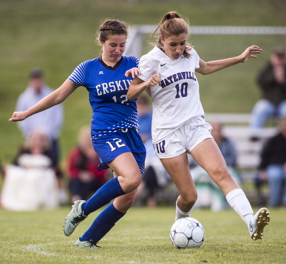 Erskine's Lydia Boucher (12) battles with Waterville's Sadie Garling in the second half during a Class B North game Friday at Webber Field in Waterville.