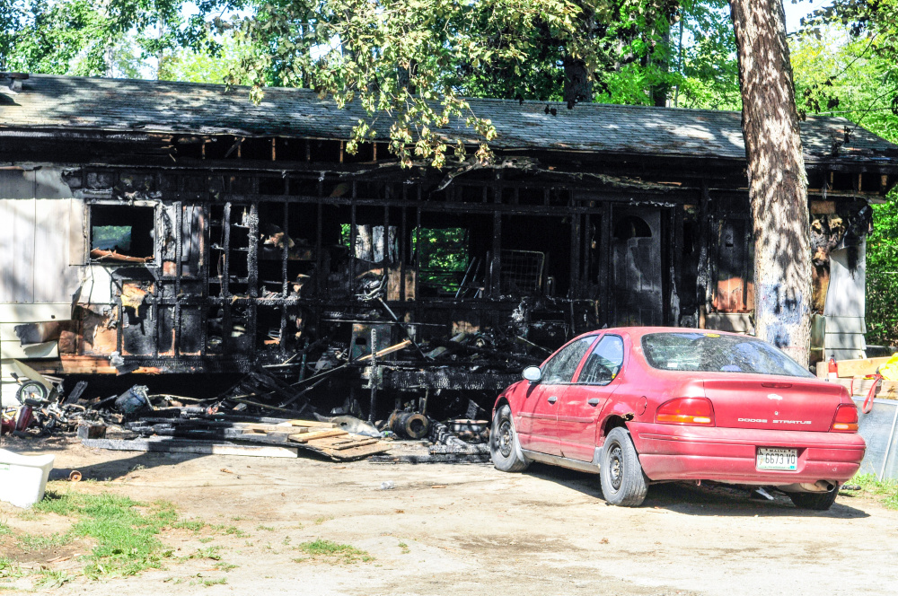 Staff photo by Joe Phelan
After a fire Friday at this Farmingdale home displaced a family of eight.