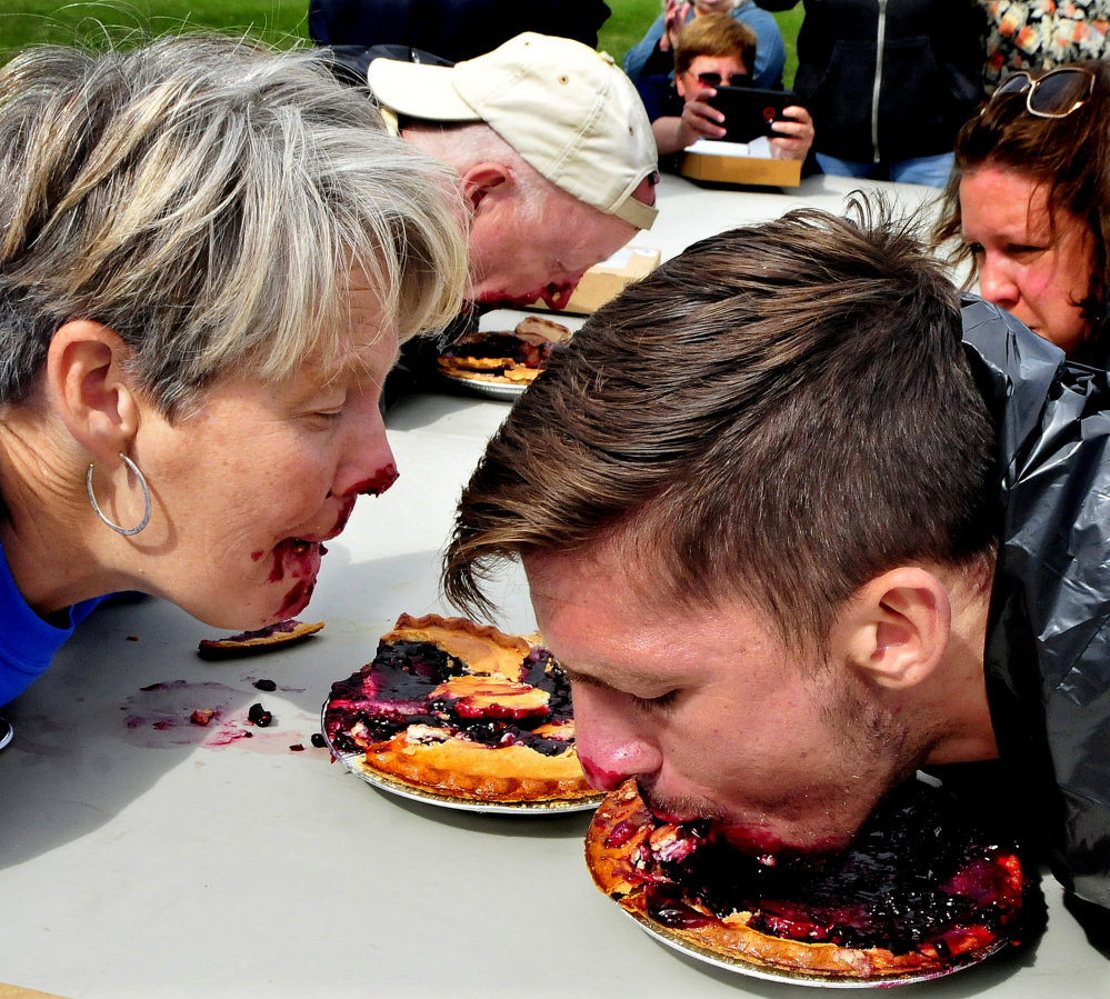 Candidates for Maine political offices compete in a pie eating contest following a Labor Day rally in Waterville on Sunday. From left are Democrat candidates for Governor Betsy Sweet of Hallowell and Patrick Eisenhart of Augusta and U.S. Senate candidate Zak Ringelstein who won the contest.