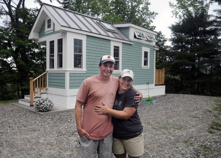 Luke Lucier and Becky Deering, shown in this August 2016 file photo, stand outside their tiny home in Richmond, where the local code enforcement officer has said no more of these types of small homes will be allowed until there are state inspection standards in place.