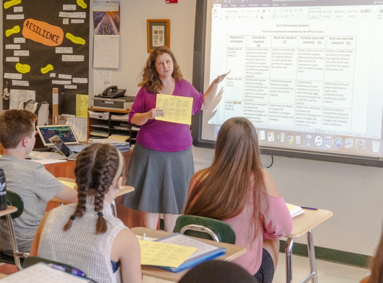 Amanda Boyce teaches honors geometry Thursday at Winthrop High School. Winthrop High School will be participating in a regional program to train math coaches, a collaborative project that will benefit teachers at the school.