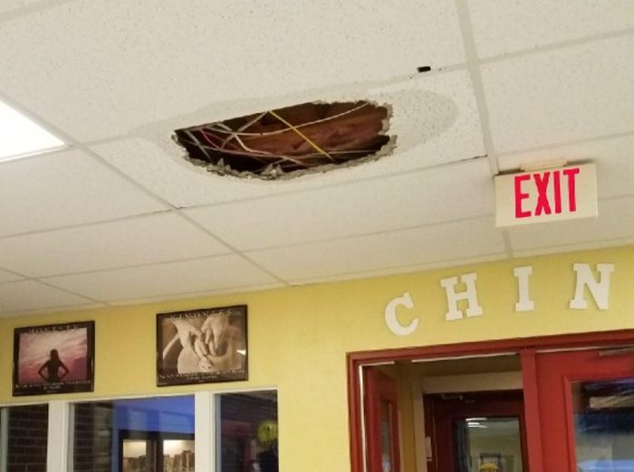 Water damage is seen on the ceiling inside China Middle School after heavy rain on Tuesday caused flooding inside the building.