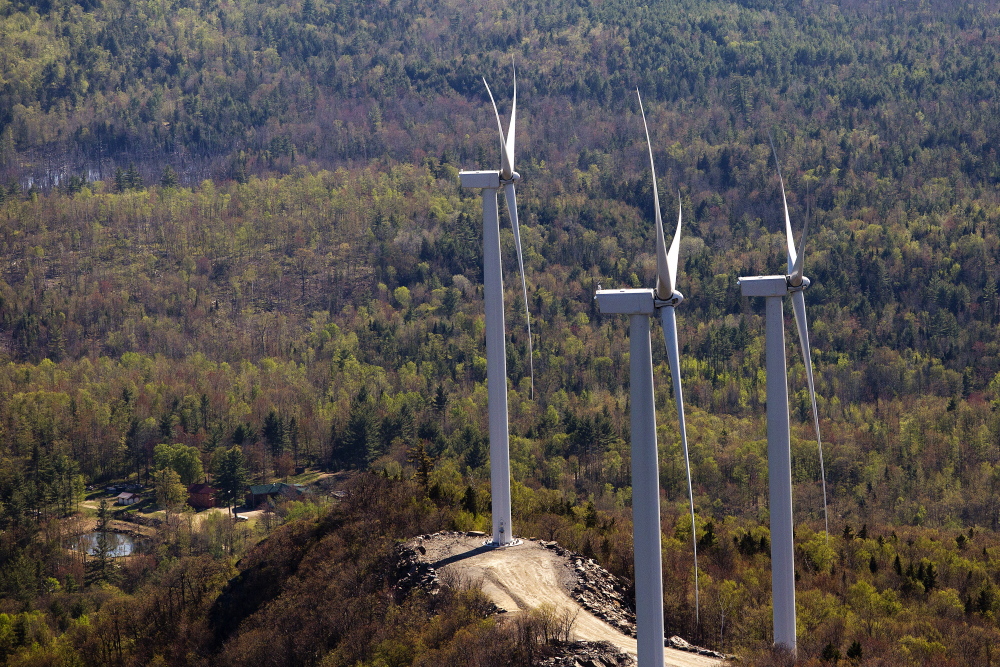 Three wind turbines owned by Patriot Renewables are seen along Saddleback Ridge in Western Maine on May 14, 2015.