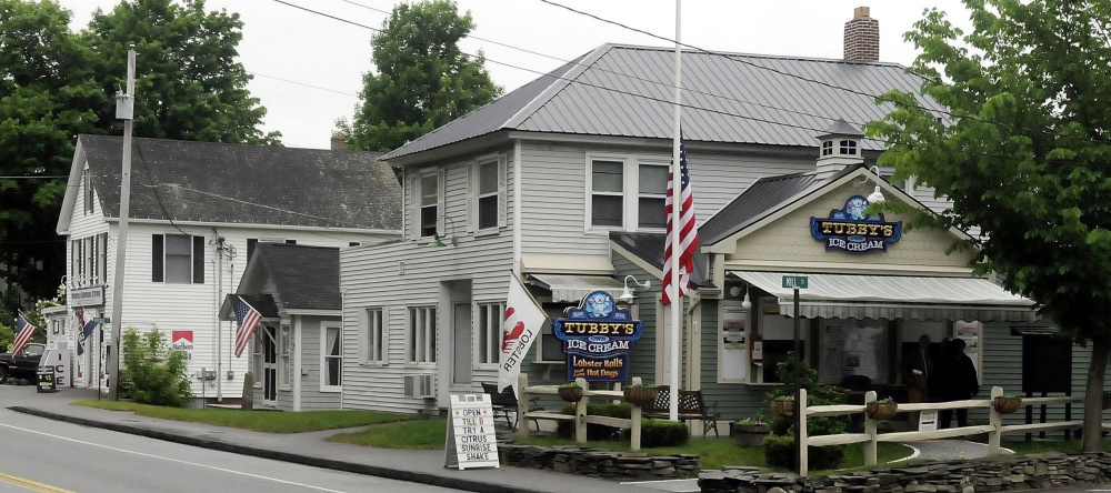 The Wayne village center, featuring the Wayne General Store, left, and Tubby's Ice Cream on Route 133, soon will see signs and lights that advertise the need to slow down and watch for pedestrians, thanks to grant funding from AARP.