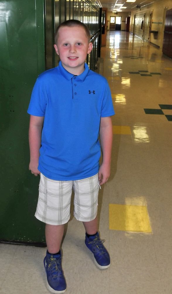 Dillon Whitney of Burnham, pictured in the hallway of Warsaw Middle School in Pittsfield on Monday, raised almost $400 selling soft drinks and snacks at the Clinton Lions Agricultural Fair recently to donate to hurricane relief efforts through the Red Cross.