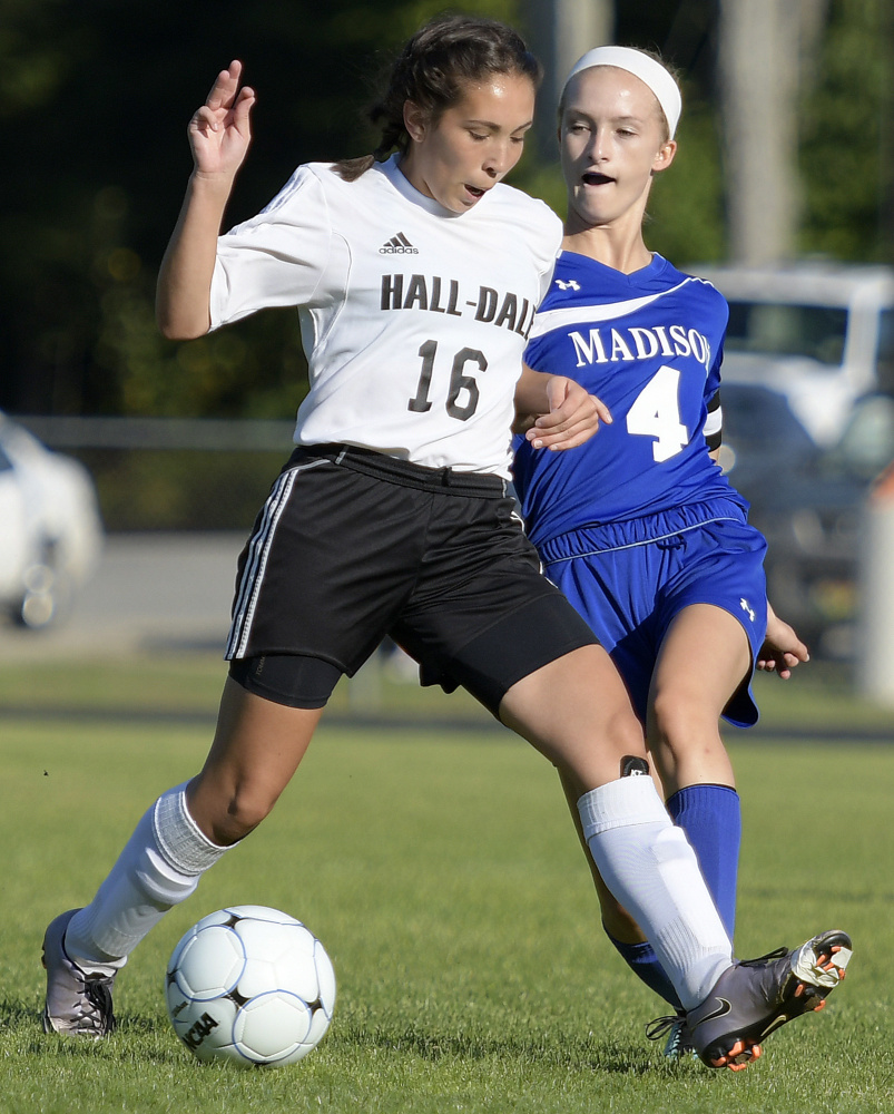 Madison senior Whitney Bess, right, tries to stop Hall-Dale senior Isabelle Martinez during a Mountain Valley Conference game Tuesday afternoon in Farmingdale.