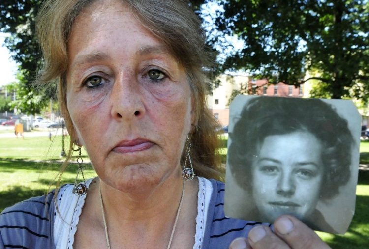 Honey Rourke, of Lewiston, holds a 1970 photograph of her mother, Pauline Rourke, on July 26. Pauline Rourke disappeared in 1976 and is believed to have been murdered by Albert Cochran, who died recently in prison.